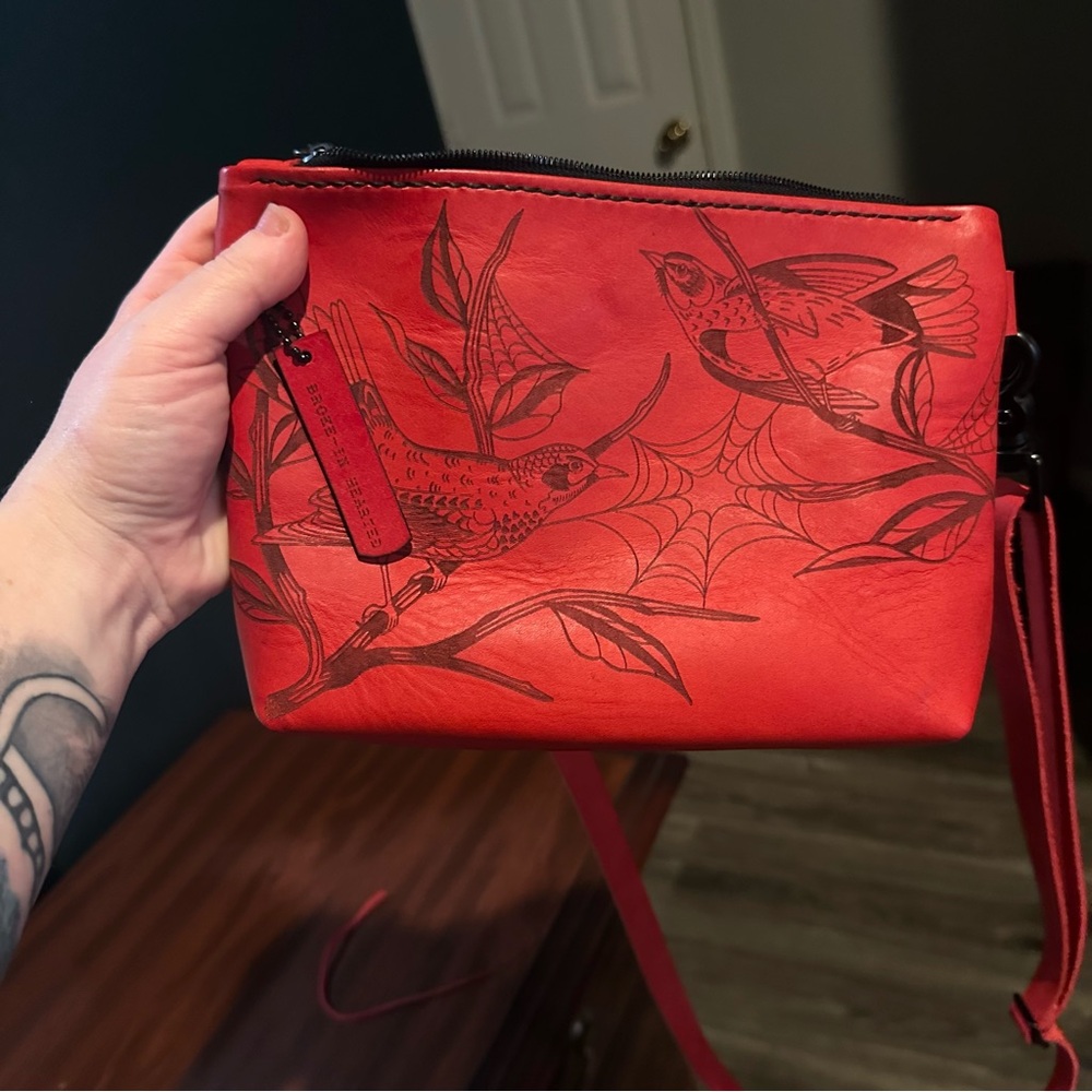 Cherry red broke in hearted leather spooky birds bag